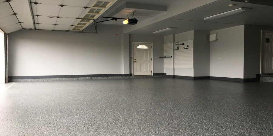 This image shows a garage that has a new floor concrete coating.